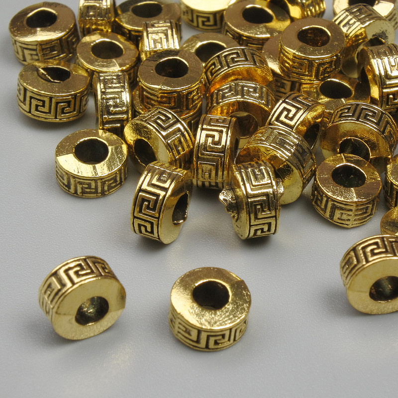 Koraliki-wkładki w kolorze metalu złoto, średnica 6,5×4 mm, otwór 2,8 mm, opakowanie 20 g (około 37 szt.)