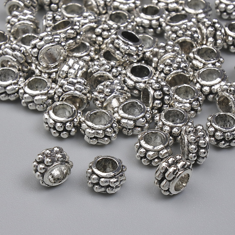 Koralik-wstawka w kolorze srebra, średnica 5,5×3,5 mm, otwór około 2,9 mm, opakowanie 20 g (~60 szt.)