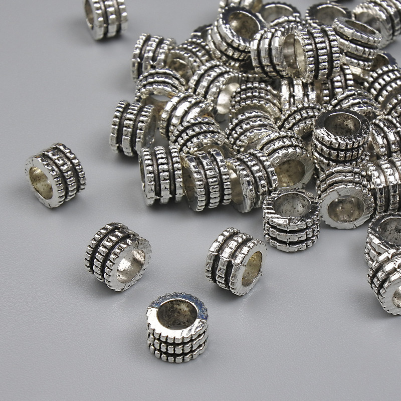 Okucia – koralik-wstawka w kolorze metalu srebrnym, średnica 6x4 mm, otwór ~3,8 mm, opakowanie (~32 szt.)