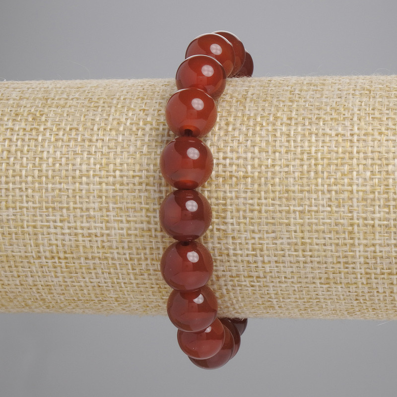 Bransoletka z karneolu, gładkie kuleczki, średnica około 10 mm, długość około 18 cm, na elastycznej gumce