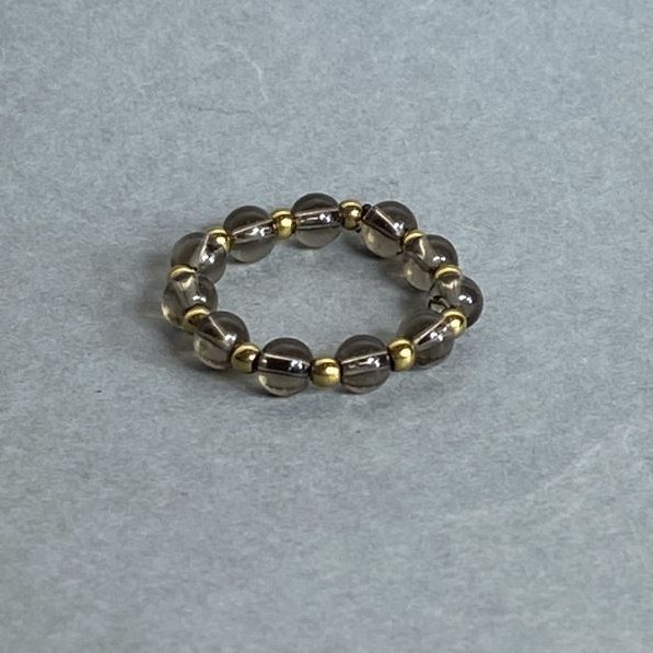 Bransoletka z topazu dymnego (rauchtopaz) i hematitu – gładkie kuleczki, średnica 4 mm ±, kuleczki hematitu 2 mm ±, na elastycznej gumce