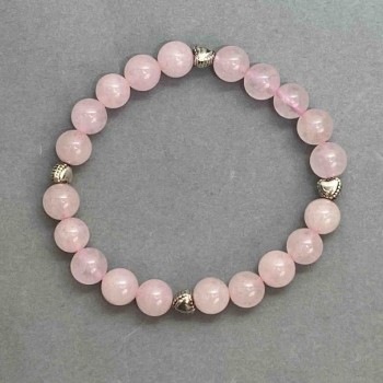 Bransoletka z różowym kwarcem, gładkie kulki o średnicy około 8 mm, z metalowymi wstawkami, długość około 18 cm, na elastycznej gumce