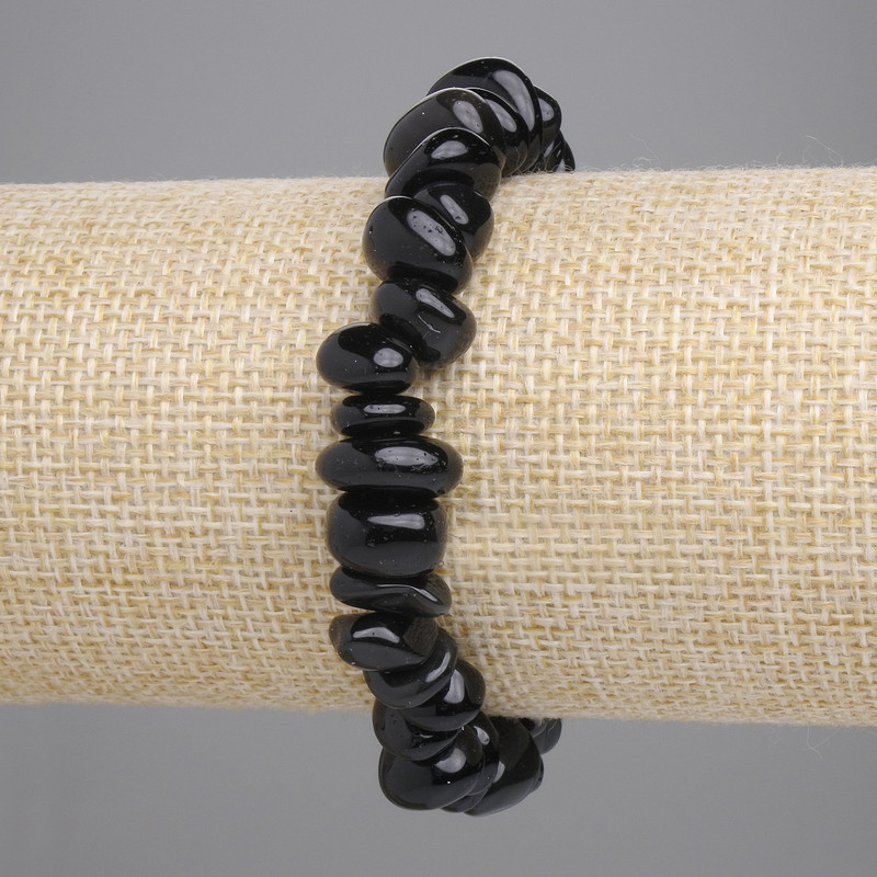 Bransoletka ze srebrzystego obsydianu, fasetowane kuleczki 8–13×4–6 mm, długość ok. 18 cm, elastyczna