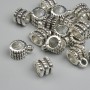 Zawieszka bail, kolor metalu srebrzysty, wymiary 6,5×9,5 mm, otwory 2,2 mm i 4,6 mm, opakowanie 18 szt.
