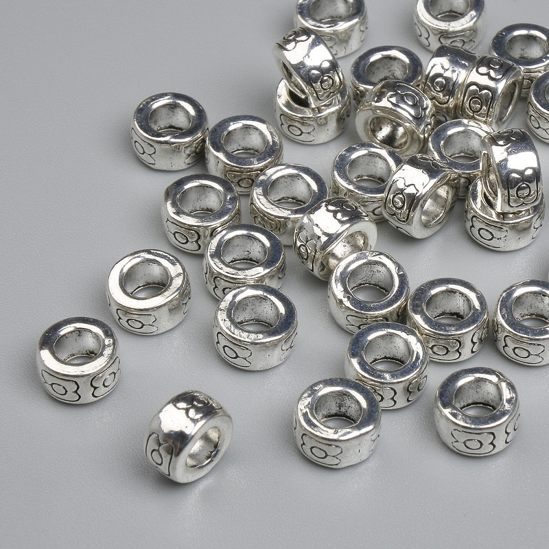 Koralik-wstawka o kolorze metalu srebrnym, średnica 7×4 mm ± otwór 3,6 mm ± opakowanie 20 g ~35 szt.