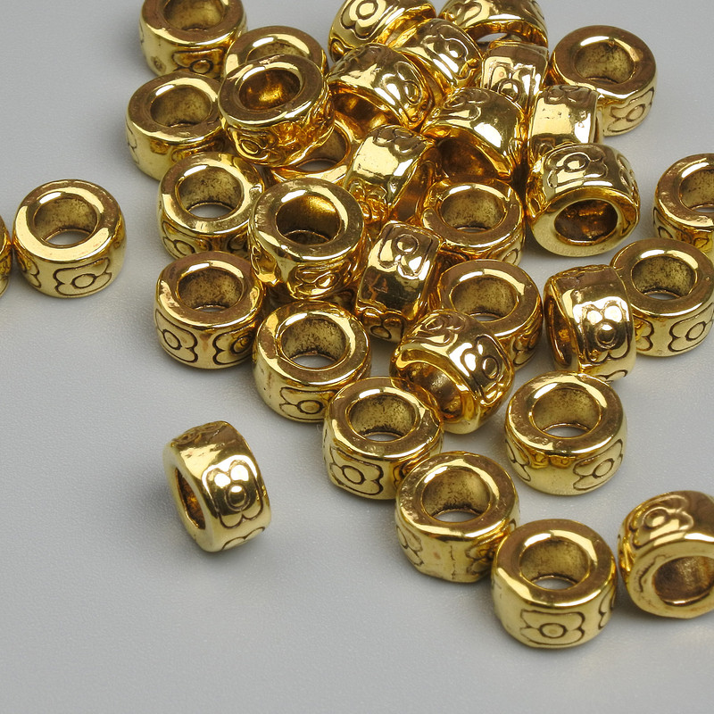 Koralik-wkładka, kolor metalu: złoty, średnica 7×4 mm, otwór ok. 3,6 mm, opakowanie 20 g ~ 33 szt.