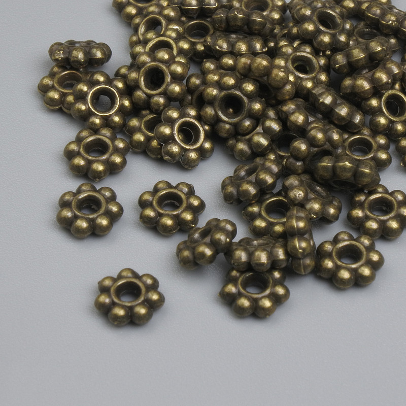 Okucie koralik-wstawka w kolorze brązowym, średnica 5,5×1,5 mm, otwór ~2 mm, opakowanie ~48 szt.