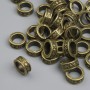 Koralik-wkładka brązowego koloru, wymiary 7,5×3 mm, otwór ~5 mm, opakowanie ~38 szt.