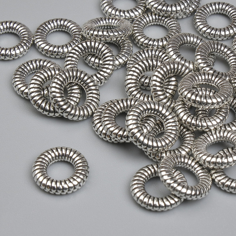 Koralik-wstawka do biżuterii, kolor metalu: srebrny, średnica 9 mm ± otwór, średnica 4,3 mm ± opakowanie ~35 szt.