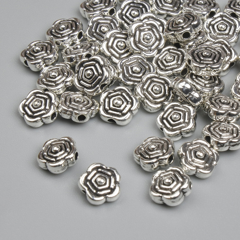 Koralik-wstawka w kolorze srebra, średnica 6,5 mm ±, otwór 1,8 mm ±, opakowanie ~41 szt. +