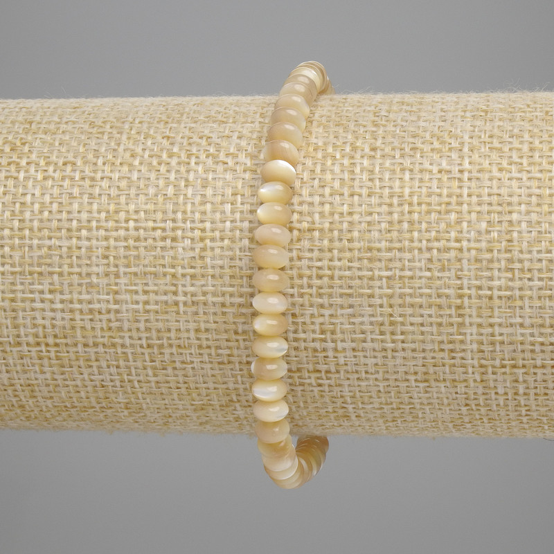 Bransoletka z beżowej masy perłowej w formie rondeli, średnica 5×2 mm, długość 18 cm, elastyczna