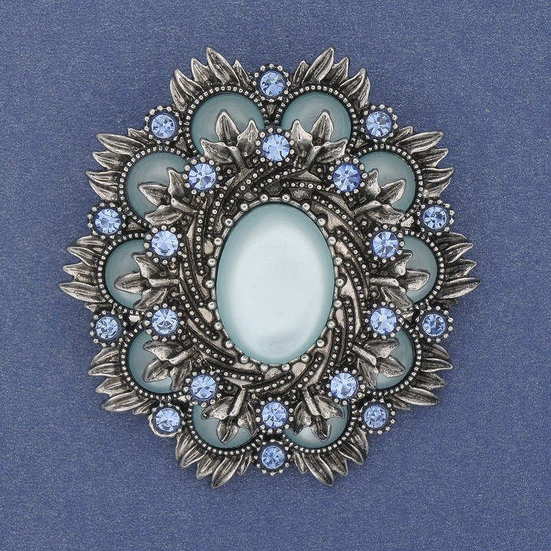 Broszka-kulon Akcent z kamieniem kocie oko, niebieskie kryształki, metal srebrzysty, 54×47 mm+