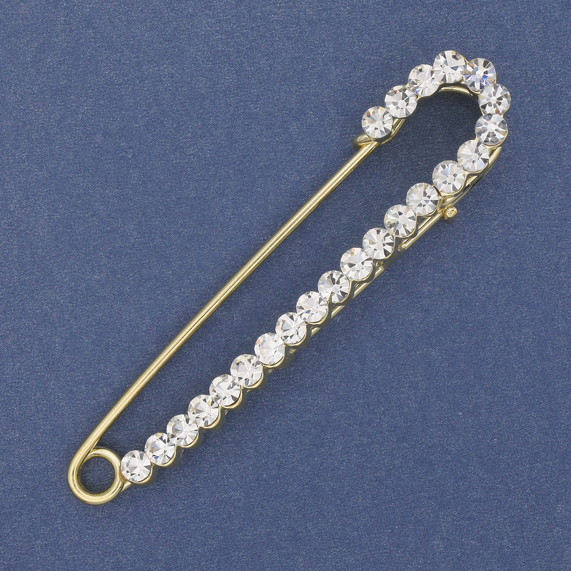 Broszka-igła z białymi kryształkami, 75×16 mm ± złoty metal
