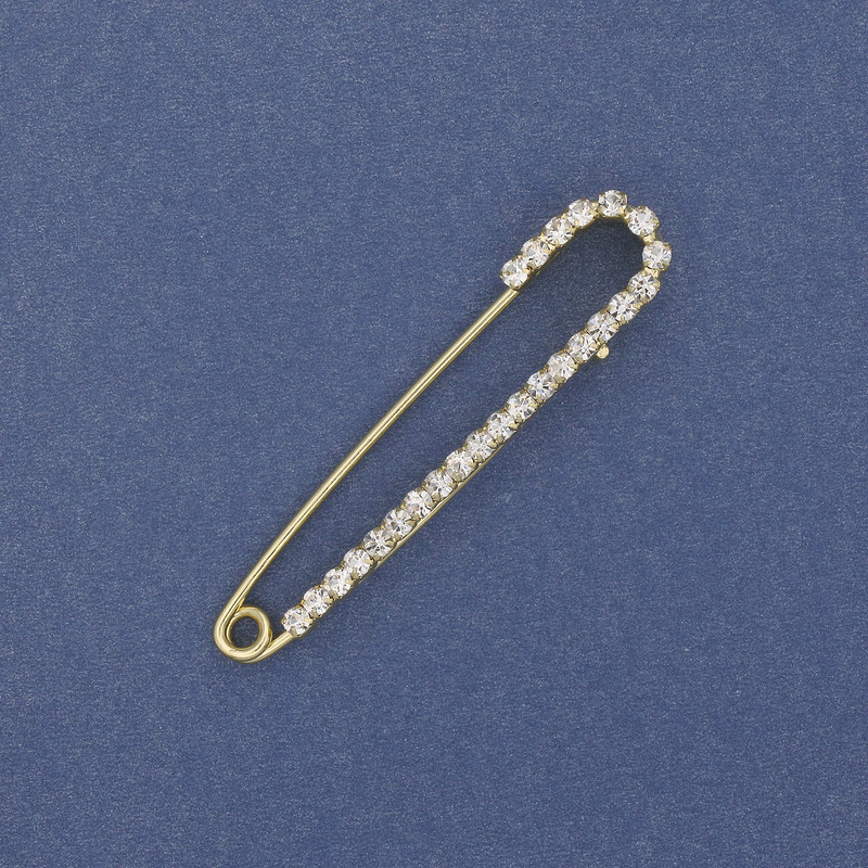 Broszka-spinka z białymi cyrkoniami 56×11 mm ± złocisty metal