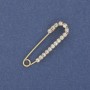 Broszka-spinka z białymi cyrkoniami, 36×10 mm ± metal złocisty