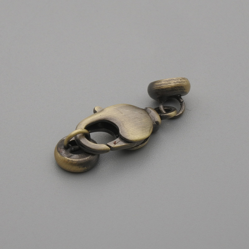 Cena za 1 szt. Zapięcie karabińczyk, średnica 17×7 mm ±, średnica 6 mm ± kolor metalu: brązowy