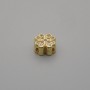 Koralik-wstawka w kształcie koniczyny, złocisty kolor metalu, z cyrkonami, średnica 7×7 mm ±, otwór o średnicy 1 mm ±, za 1 szt.