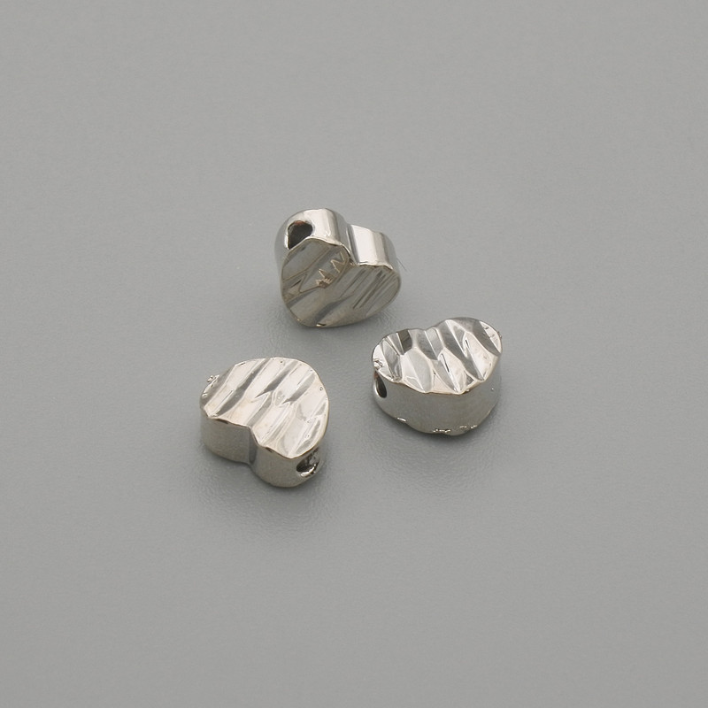 Koralik-wstawka w kształcie serca, kolor metalu srebrny, średnica 6×5 mm ±, otwór średnicy ~1,3 mm ±, na 1 szt. +