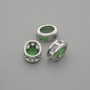 Okucia biżuteryjne, koralik-wkładka z zielonym kryształem, kolor metalu srebrny, owalny, średnica 9×7 mm ±, otwór Ø 1,3 mm ± za 1 szt.