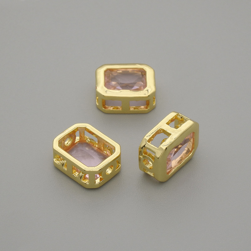 Galanteria jubilerska - wkładka koralikowa z różowym kryształem, kolor metalu złoty, średnica 9×7 mm ±, otwór 1,3 mm ±, za 1 szt. +