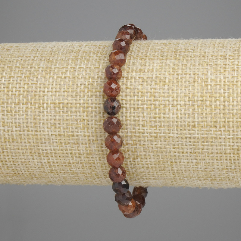 Bransoletka z granatu gessonitu, fasetowana kulka, średnica 6 mm ±, długość 18 cm ±, na elastycznej gumce