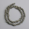 Koraliki z pirytu, nieobrobione bryłki, średnica 4–6×3–7 mm, długość 40 cm
