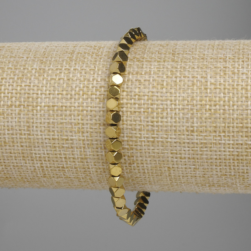 Bransoletka z hematytu w formie wielokątnych brył 4×4 mm, kolor złoty, długość 18 cm, stretch