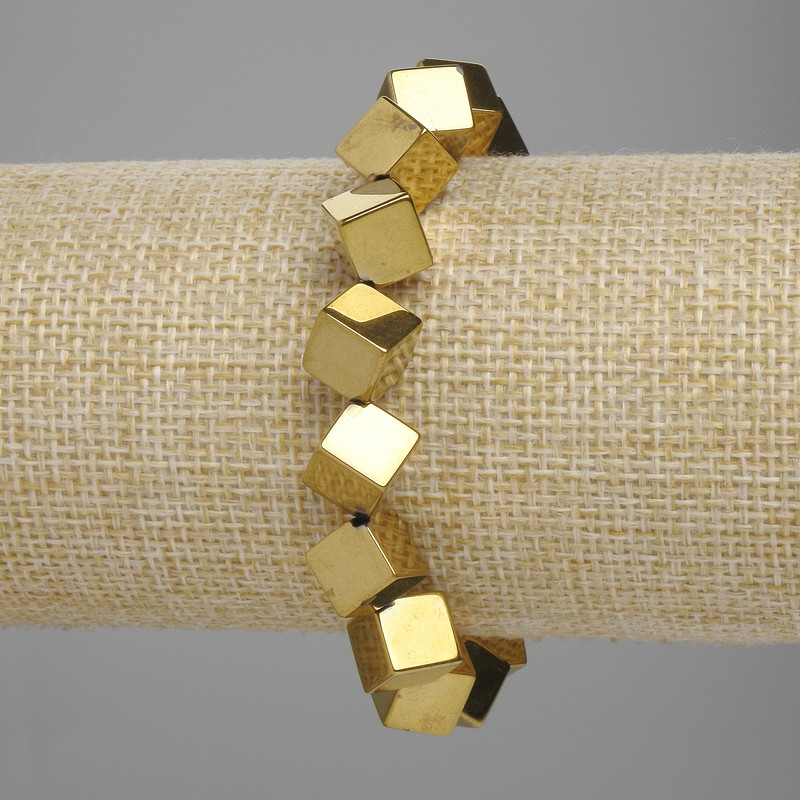 Bransoletka z hematitu, kostka z otworem poprzecznym 8×8 mm, kolor złocisty, długość 18 cm, elastyczna