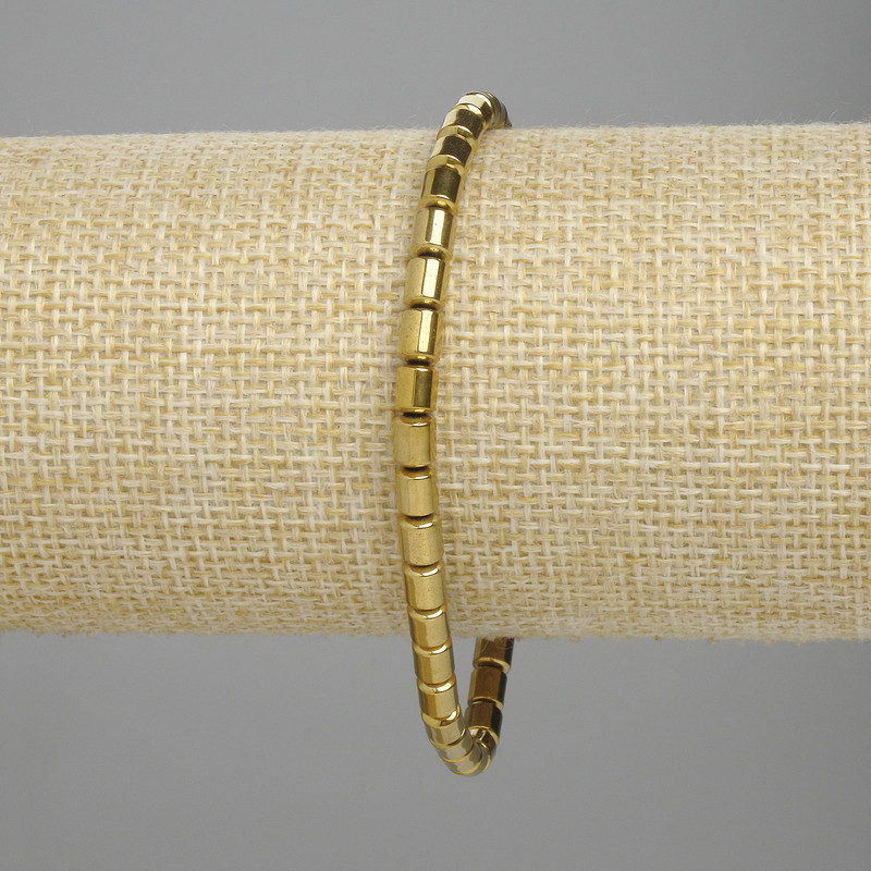 Bransoletka hematyt cylindryczny 5×4 mm ± kolor złoty, długość 18 cm ± elastyczna