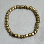 Bransoletka z hematytu w kolorze złota – kostki hematytu 5 mm oraz trójkątne rondelki 6×4 mm, długość ok. 18 cm, elastyczna