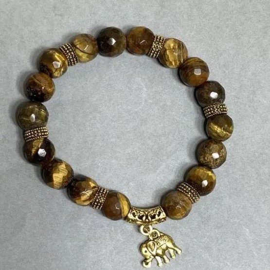 Bransoletka z tygrysiego oka, fasetowane kulki o średnicy ok. 10 mm ±, z metalowymi wstawkami, długość ok. 18 cm ±, elastyczna