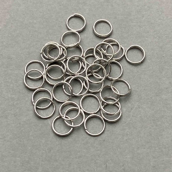 Akcesoria jubilerskie - pierścień łączący sprężynowy, średnica 7 mm, srebrzysty metal, opakowanie 1 kg