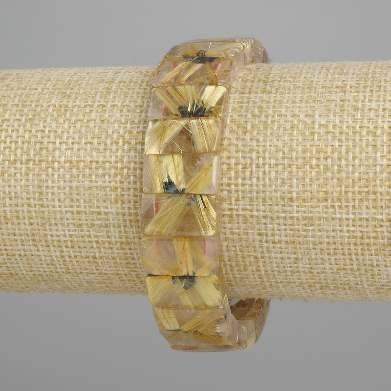 Bransoletka z naturalnego kamienia – kwarc rutylowy włosisty, gładkie ogniwa, średnica 17,5–18×8–9 mm, długość 18 cm, elastyczna