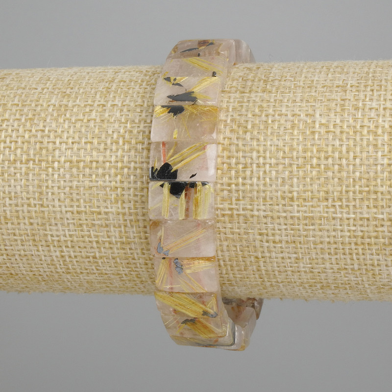 Bransoletka z naturalnego kamienia: kwarc rutylowy włochaty, gładkie ogniwa, średnica 12×7–8 mm, długość ok. 18 cm, elastyczna