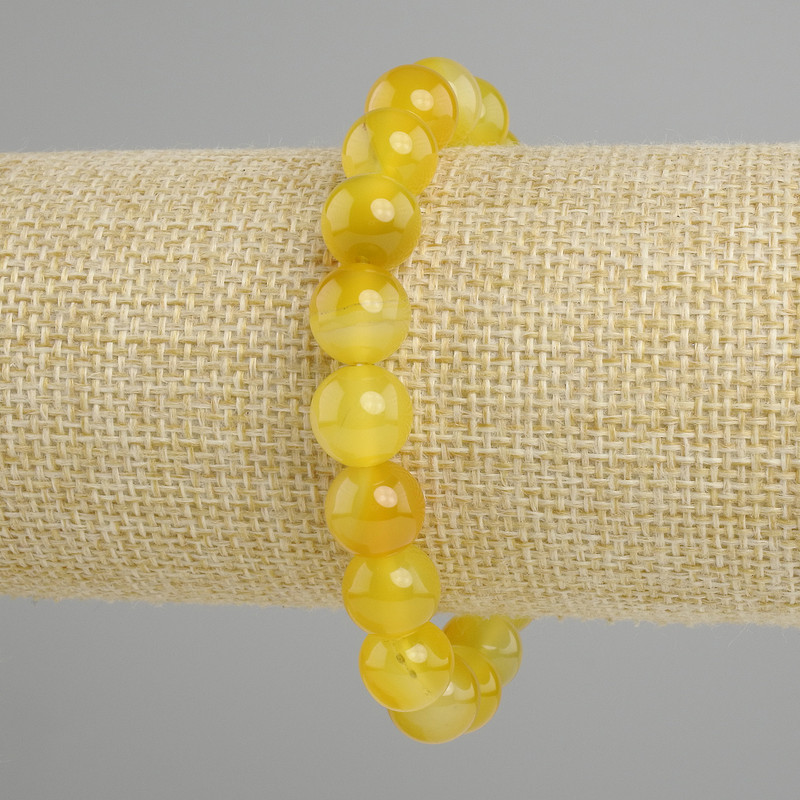 Bransoletka z żółtego agatu — gładkie kuleczki o średnicy około 10 mm, długość 18 cm ±, na elastycznej gumce