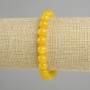 Ta bransoletka z żółtego agatu, gładkie kulki, średnica 8 mm, długość ok. 18 cm, elastyczna