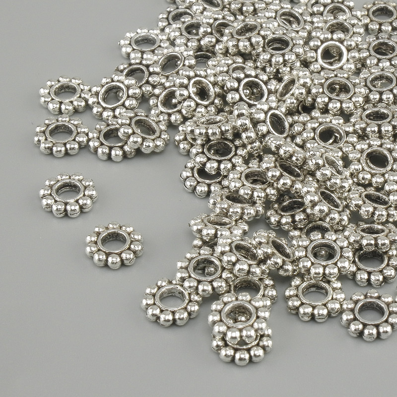 Koralik-wkładka jubilerska w kolorze srebrnym, średnica 6 mm ±, otwór 3 mm ±, opakowanie 20 g (~ok. 93 szt.)
