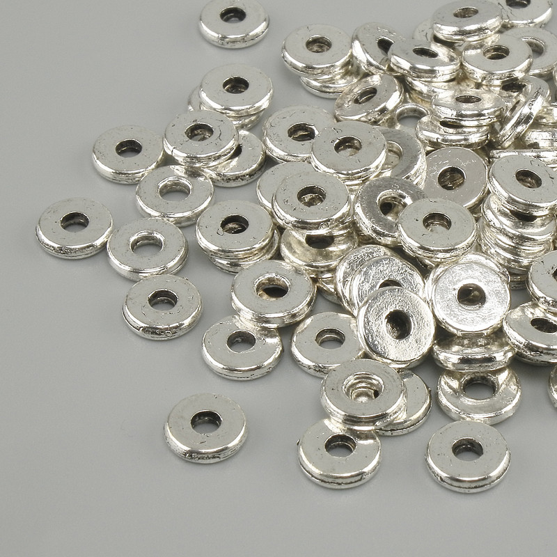 Koralik-wkładka, kolor metalu srebro, średnica 6 mm ±, otwór 2,5 mm ±, opakowanie 20 g (~100 szt.)