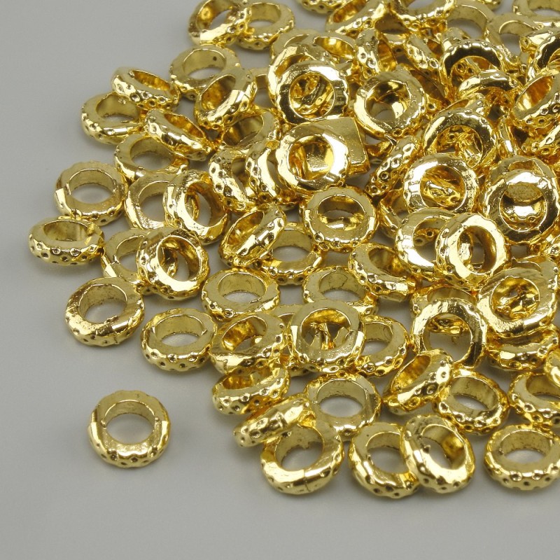 Koralik-wstawka kolor metalu: jasne złoto, średnica koralika około 5,5 mm, otwór około 3,8 mm, opakowanie 20 g (~119 szt.)