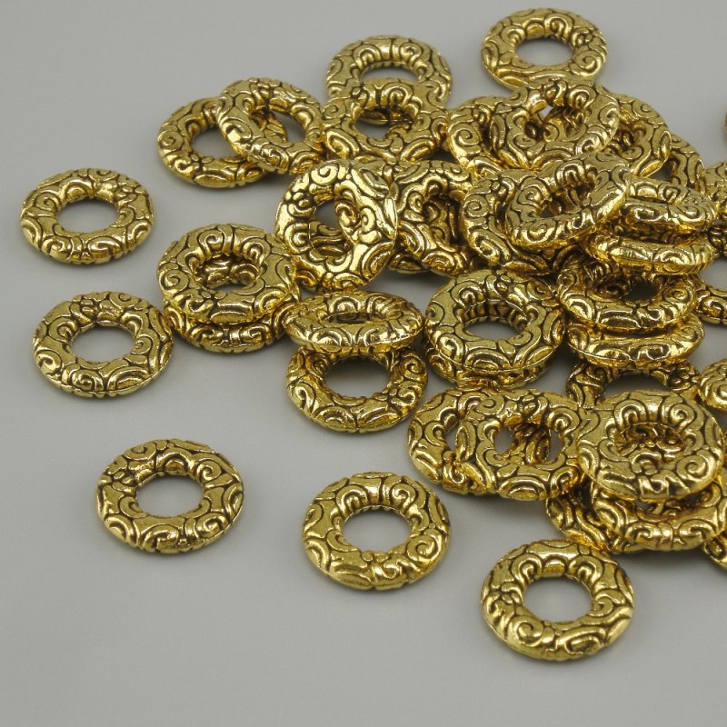 Koralik-wstawka w kolorze żółtego złota, średnica 8 mm ±, otwór 4 mm ±, opakowanie 20 g (~44 szt.)