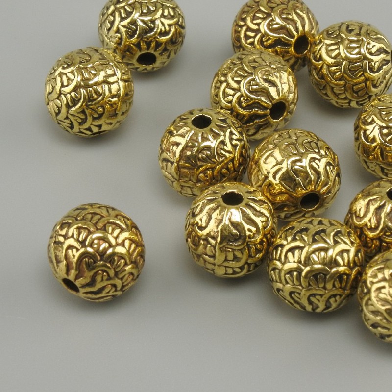 Koralik-wstawka w kolorze żółtego złota, średnica 7,5 mm ± otwór, średnica 1,9 mm ± opakowanie 20 g (~15 szt.)