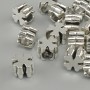 Koralik-wstawka w formie krzyża, kolor metalu srebrny, średnica 9×9 mm, otwór Ø 4,9 mm, opakowanie 20 g (~15 szt.)