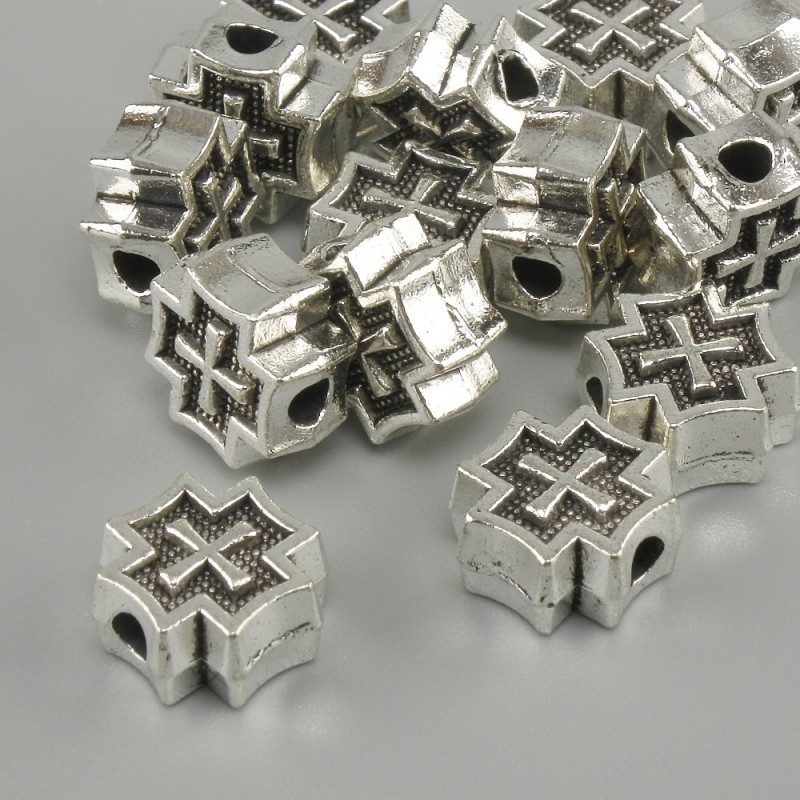 Koralik-wstawka w kształcie krzyża, kolor metalu: srebrny, średnica 9×9 mm ±, średnica otworu 2,6 mm ±, opakowanie 20 g (~14 szt.)