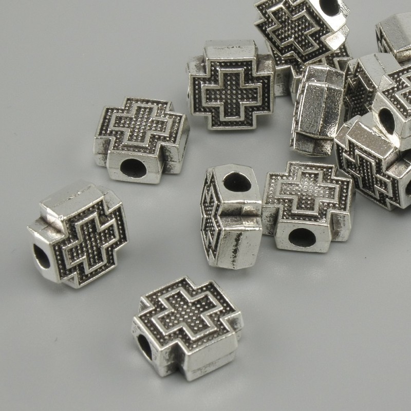 Koralik-wkładka w kształcie krzyża, kolor metalu srebrny, średnica 9×9 mm ±, otwór 3 mm ±, opakowanie 20 g (~15 szt.)