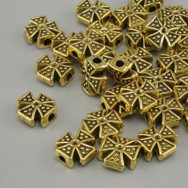 Koralik-wkładka w kształcie krzyża, kolor żółtego złota, 8×8 mm ±, otwór 2 mm ±, opakowanie 20 g (~31 szt.)