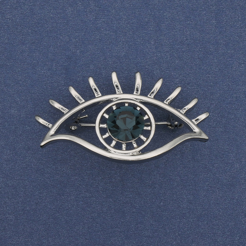 Broszka Akcent Oko błękitny kryształ, srebrzysty metal, 40×22 mm+