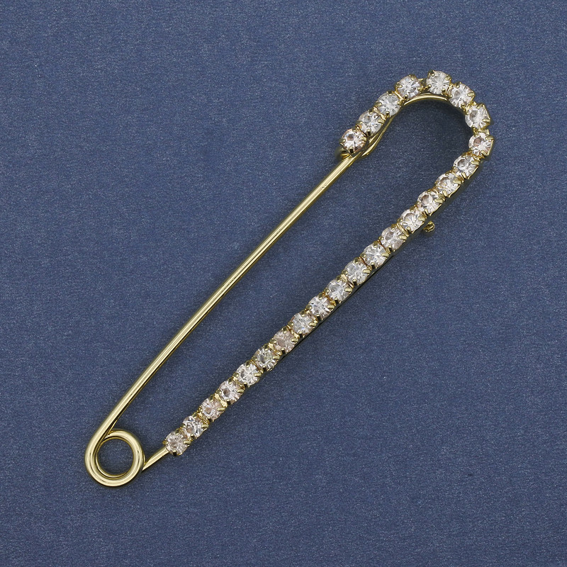 Broszka-spinka z białymi cyrkoniami 72×16 mm ± złocisty metal
