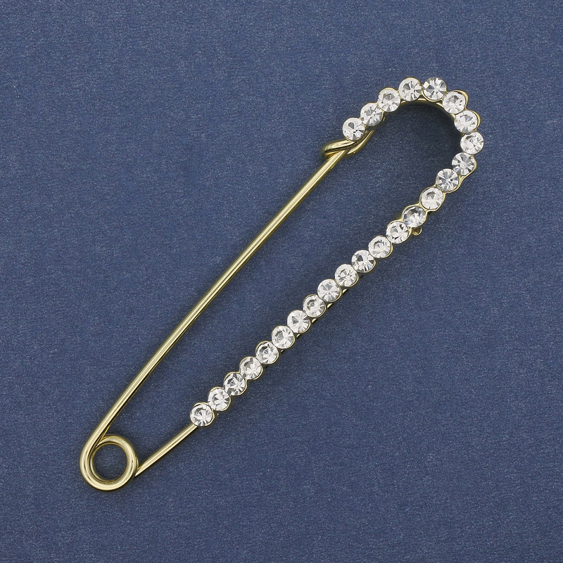 Broszka-spinka z białymi kryształami, 72×17 mm ±, złotego metalu