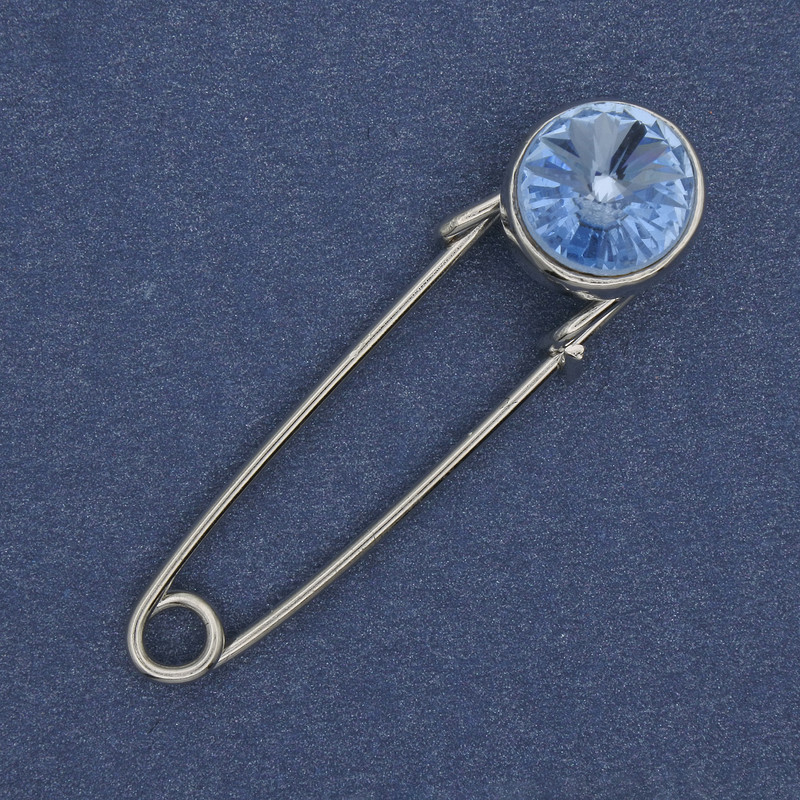Broszka-spinka z błękitnym kryształem 38x10 mm +/- srebrzysty metal