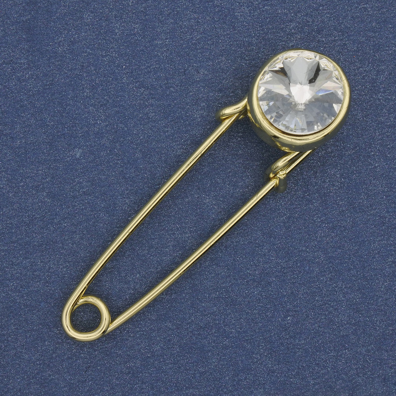 Broszka-spinka z białym kryształem 38×10 mm ± złocistym metalem